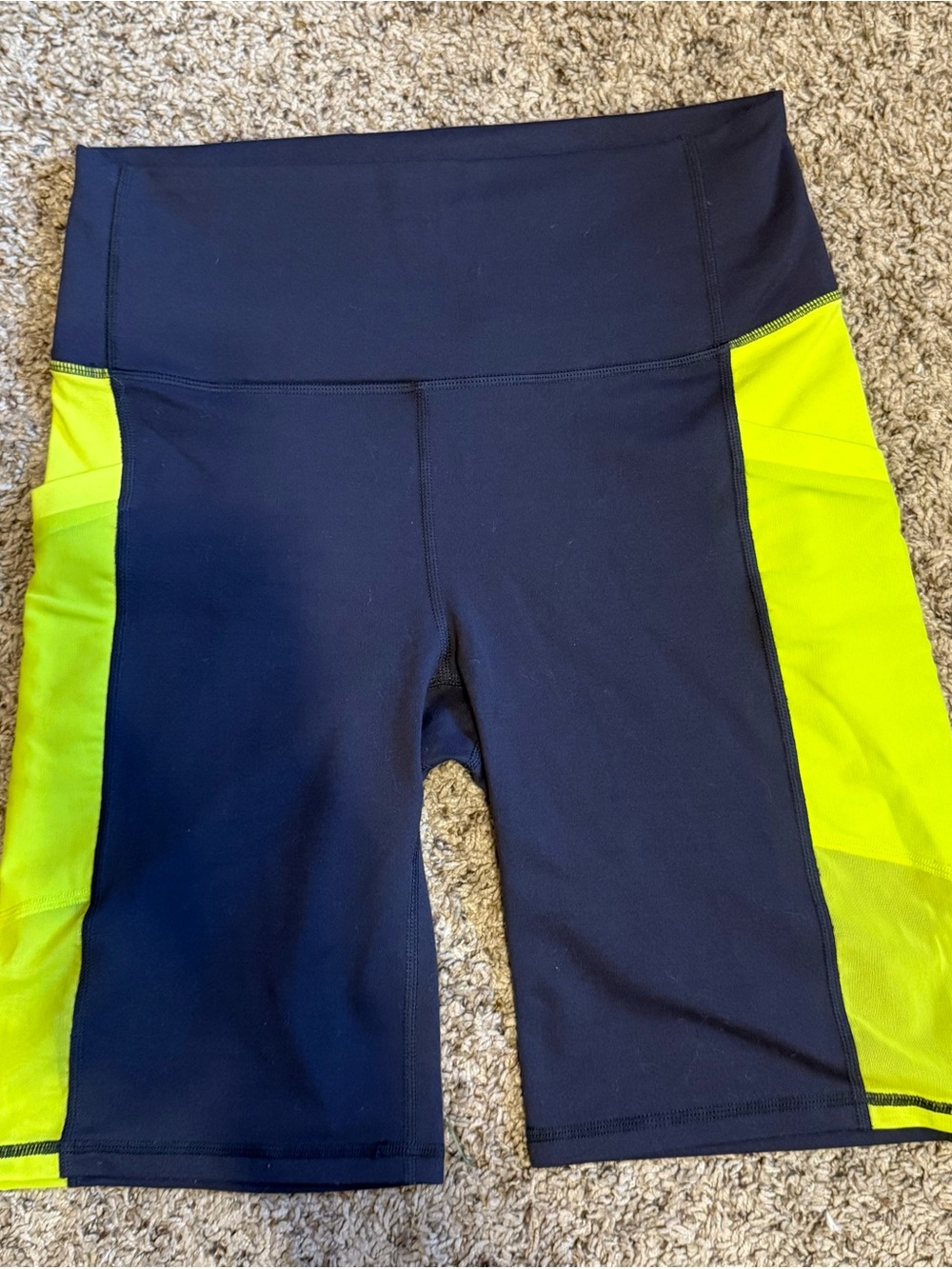 Fabletics PowerHold High-Waist Bike shorts - gray and neon.